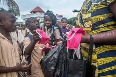 Jittery, and partly maskless, reopening for Benin schools