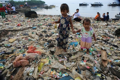 Indonesians clean up the beach one sandal at a time