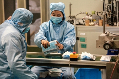 As China needs virus masks, phone and diaper makers fill void