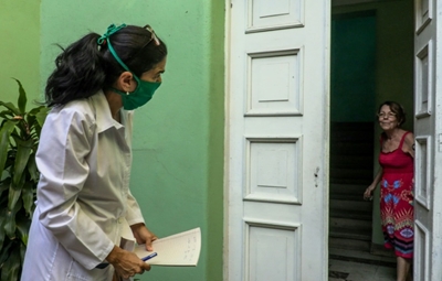In Cuba, medical students provide door-to-door virus care