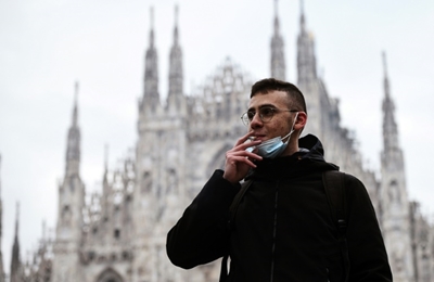 Choked-up Milan takes smoking ban outside