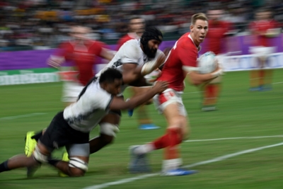 Wales tame ferocious Fiji to reach World Cup quarter-finals