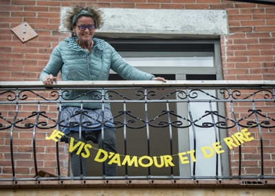 Artist brightens up pandemic-weary Montreal with balcony banners