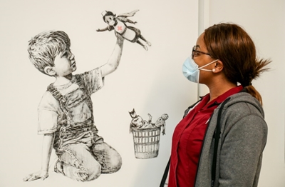 Banksy tribute to UK health service displayed in hospital