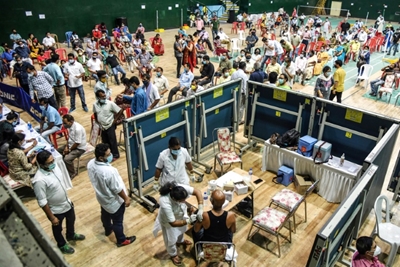Race for jabs in India's vaccination drive exposes digital divide