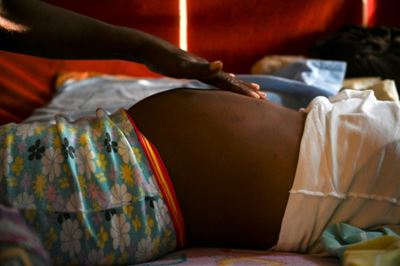 Lone midwife delivers amid chaos of Colombia jungle river