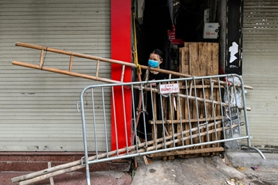 Beer crates and broken chairs: barricades divide up locked-down Hanoi
