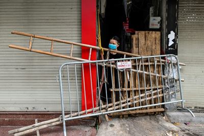 Beer crates and broken chairs: barricades divide up locked-down Hanoi
