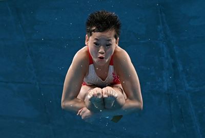 China's Quan, 14, wins Olympic gold with three perfect dives