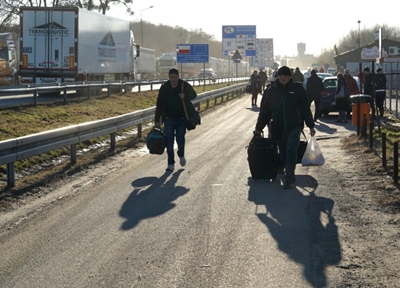 Ukrainian refugees camp out at Polish train station  