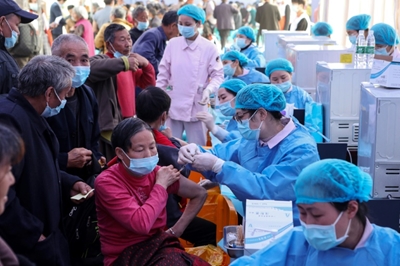China gives one-billionth Covid shot as Brazil toll hits milestone