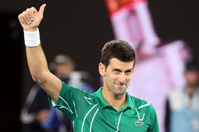 Djokovic keeps focus to set up Federer semi-final 