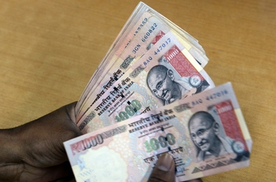 Indian rupee hits record low of 70 to the dollar