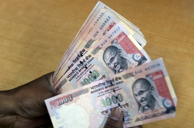 Indian rupee hits record low of 70 to the dollar