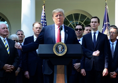 Trump threatens to send military against immigrant 'onslaught'