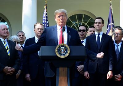 Trump threatens to send military against immigrant 'onslaught'