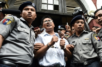 "Thumbs up" pics for Myanmar Reuters reporters as they mark year in jail 