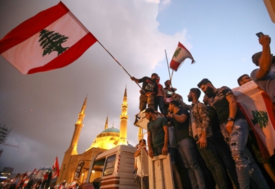 Lebanon government in 11th-hour reform drive as protests swell