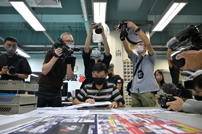 Hong Kong police arrest another Apple Daily editor under security law