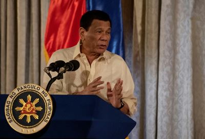 Philippine leader bugged by cockroach during speech