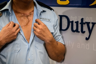 No regrets: wounded Hong Kong police vow to keep enforcing law