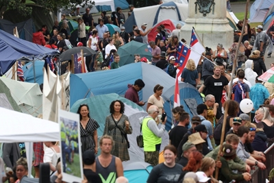 New Zealand Covid protest grows after police draw back