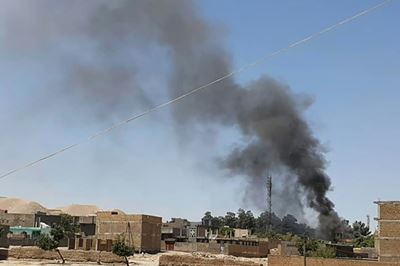 Taliban capture key border crossing as Biden defends Afghan withdrawal