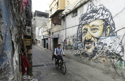 Beirut's dapper barber-on-a-bike offers curbside cuts