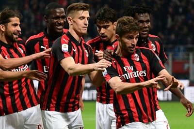 Milan back in Champions League race after fiery Bologna win