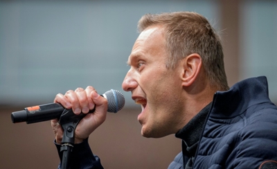 Mass raids target Russian opposition chief
