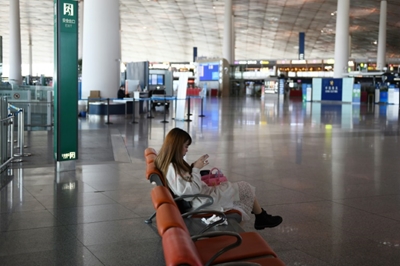 Chinese students fleeing virus face uneasy reception back home