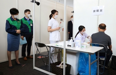Olympic staff, volunteers vaccinated as Tokyo Games near