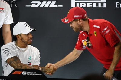 Victorious Hamilton defends rival Vettel