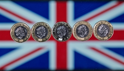 London stocks soar on takeover news; pound sinks on Brexit woes
