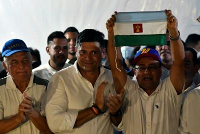 Opposition wins tense Venezuela vote in Chavez home region.