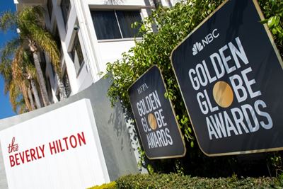 Golden Globes eye history as show goes on without stars