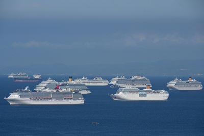 Stranded on ships, 200,000 seafarers struggle in virus limbo