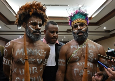 Papuans on trial in Indonesia ordered to remove penis gourds