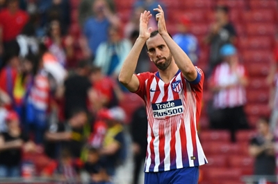 Tearful Godin confirms Atletico exit