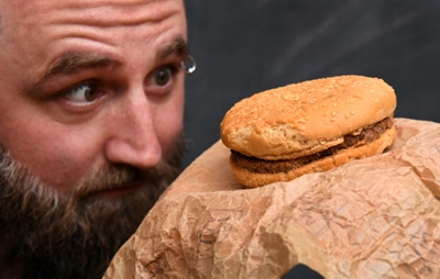 Aussie mates show off burger bought in 1995