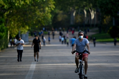 Parks packed, terraces open as Madrid and Barcelona celebrate easing