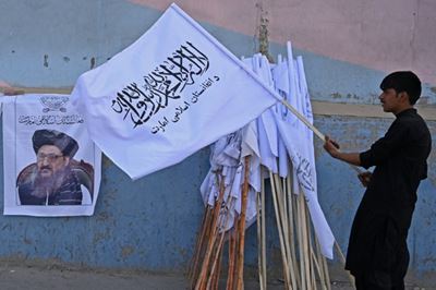 Taliban parade as Biden defends US pullout