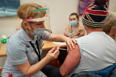 Britain races to vaccine target as Germany warns hardest days ahead