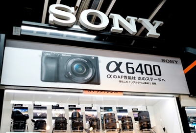 Sony reports record net profit but issues cautious forecast