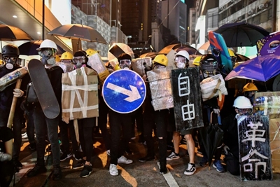 Hong Kongers harness traffic cones, kitchenware to battle tear gas