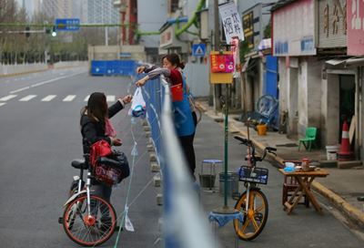 Virus-hit Wuhan waits for barriers to come down