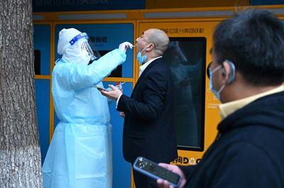 Beijing seals off mall, housing compounds after virus cases found