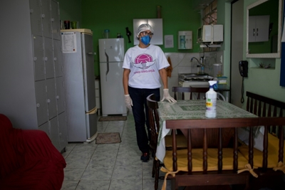 Mom who lost son to virus seeks grace in Brazil's tragedy