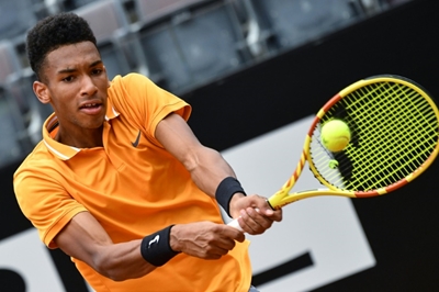 Teenage talent Auger-Aliassime records first ATP win on grass