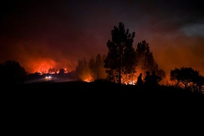 Portugal firefighters control wildfires, but warn of strong winds
